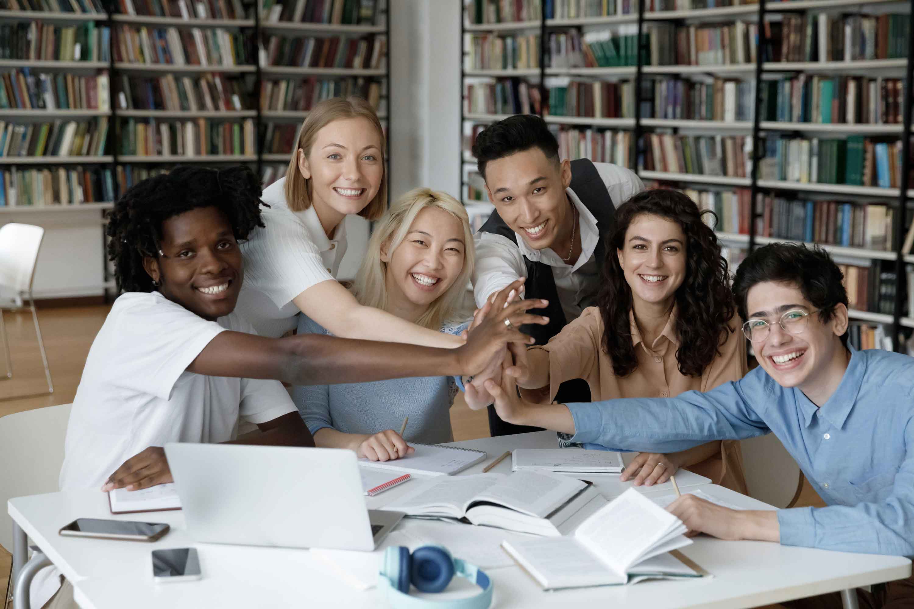 a group of students studying in a library.