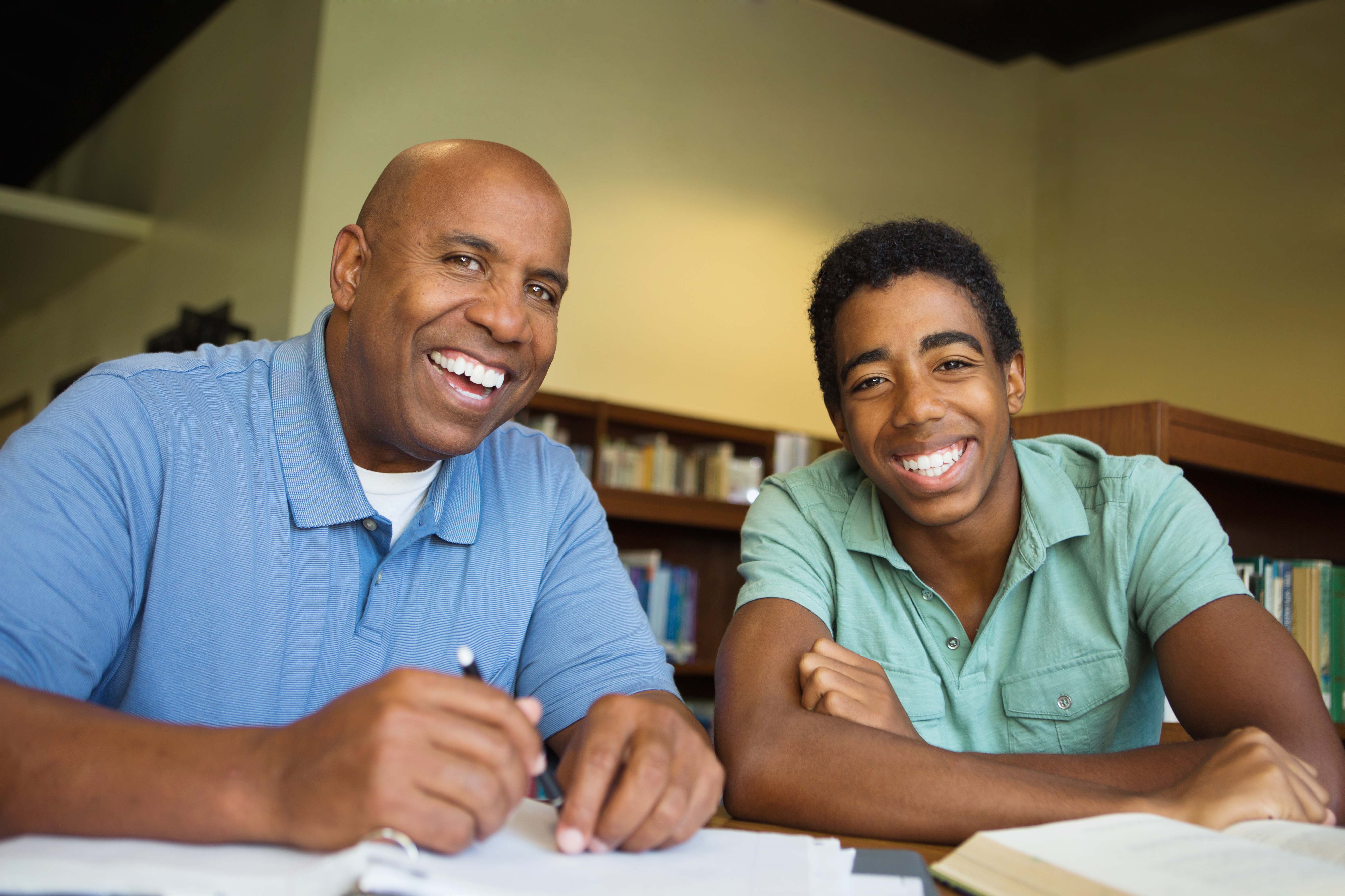 A student and mentor studying together.