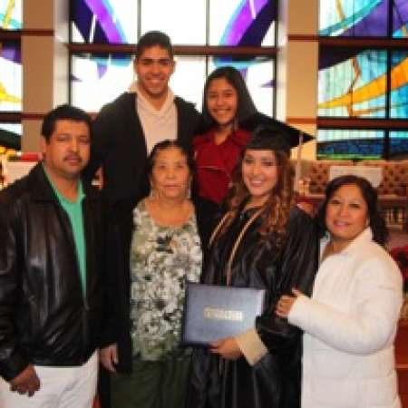 Our third college graduate Vanessa C. from OKWU with her family.