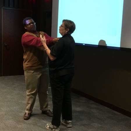 Jodi M. demonstrates Self Defense move with Chris H.