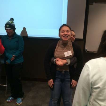 Students and parents practice self defense moves.