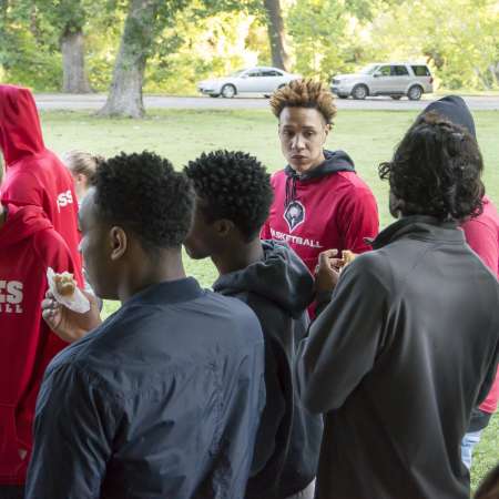 Volunteers enjoy a snack before going out on the course.