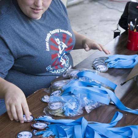 Kristin separates medals.