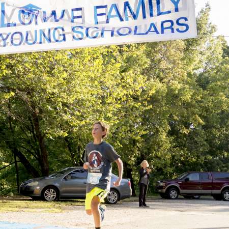 Runners cross the finish line.