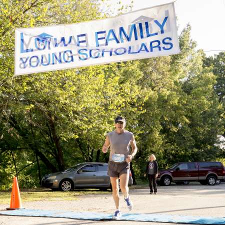 2nd Place Runner crosses the line.