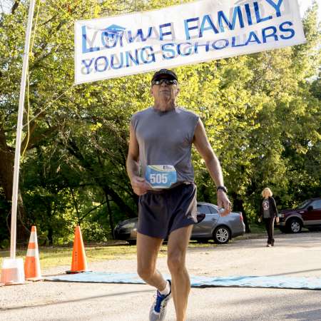 Runners cross the finish line.