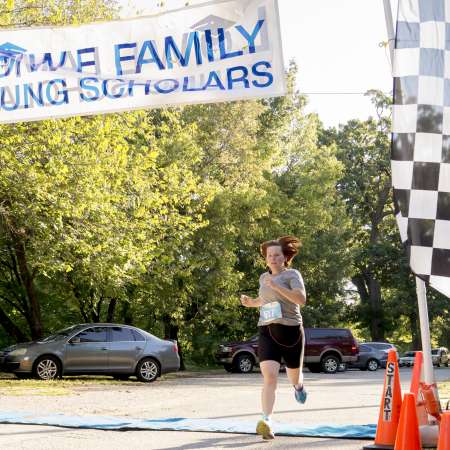 First place female comes up to the finish line.