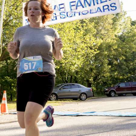 Runners cross the finish line.