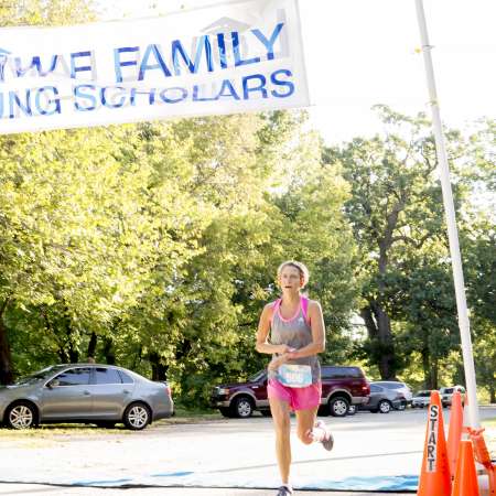 2nd Place Female runner comes across the finish line.