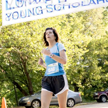 Runners cross the finish line.