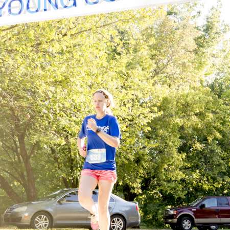 Runners cross the finish line.