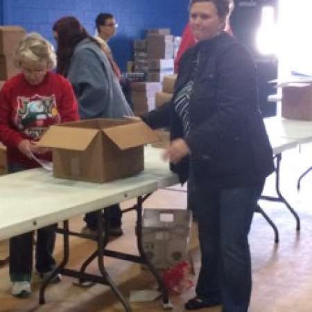 Angela E. helps to volunteer at Salvation Army event.