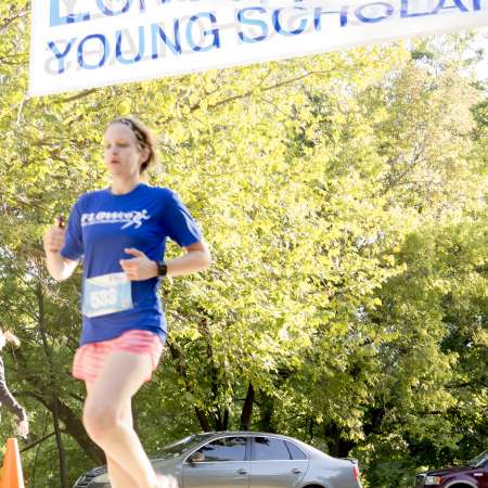 Runners cross the finish line.