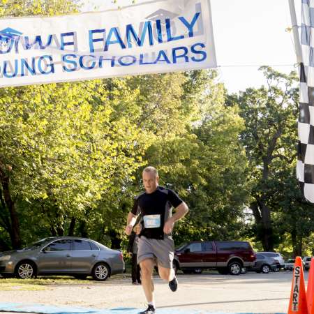 Runners cross the finish line.