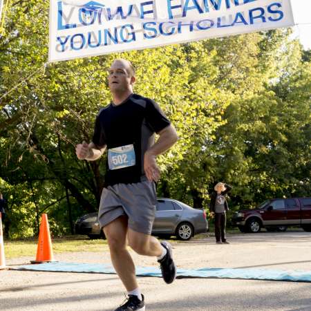 Runners cross the finish line.