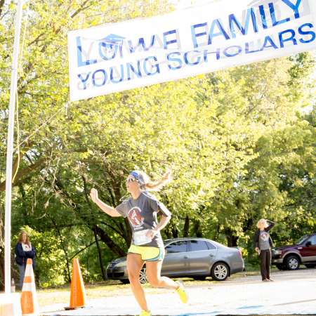 Runners cross the finish line.