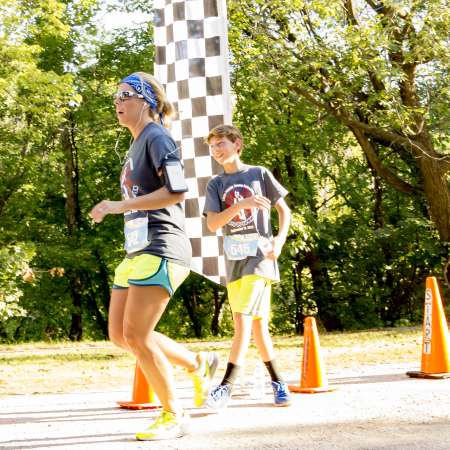 Runners cross the finish line.