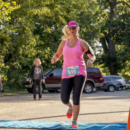 Runners cross the finish line.