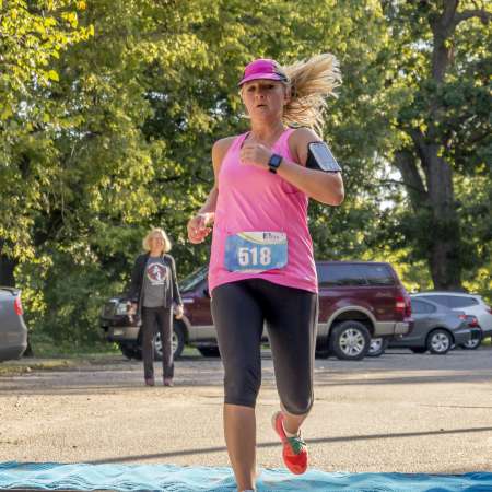 Runners cross the finish line.