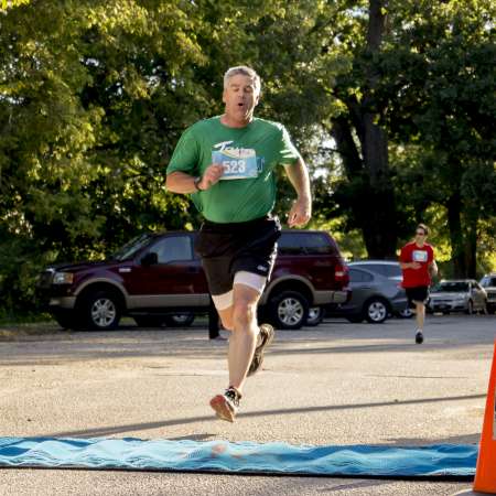 Runners cross the finish line.