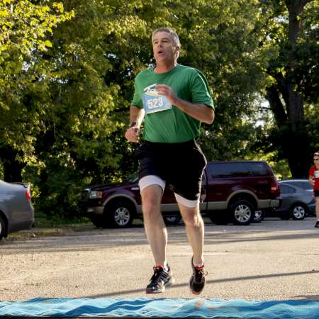 Runners cross the finish line.