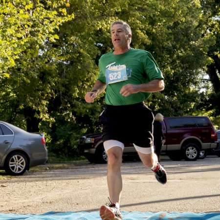 Runners cross the finish line.