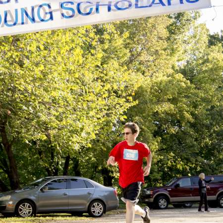 Runners cross the finish line.