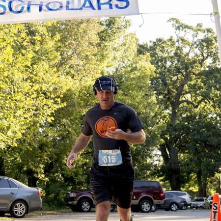 Runners cross the finish line.