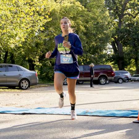 Runners cross the finish line.