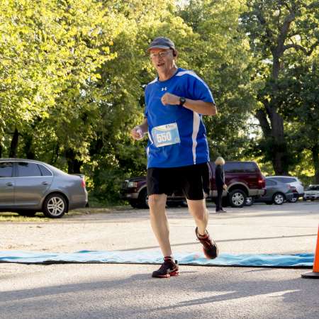 Runners cross the finish line.