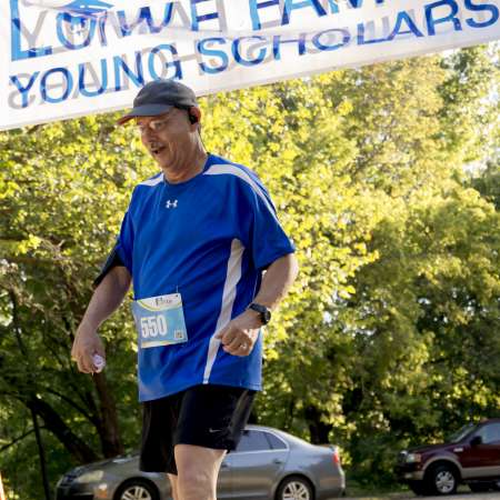 Runners cross the finish line.