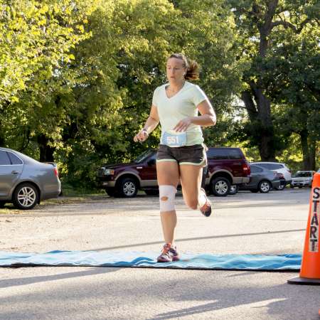 Runners cross the finish line.