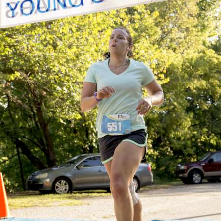 Runners cross the finish line.