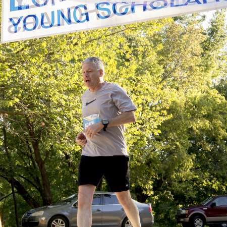 Runners cross the finish line.