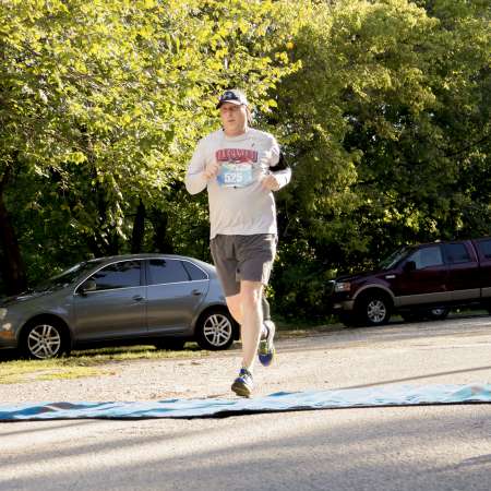 Runners cross the finish line.