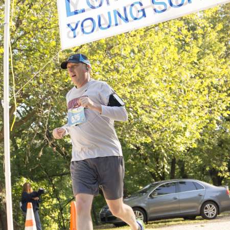 Runners cross the finish line.