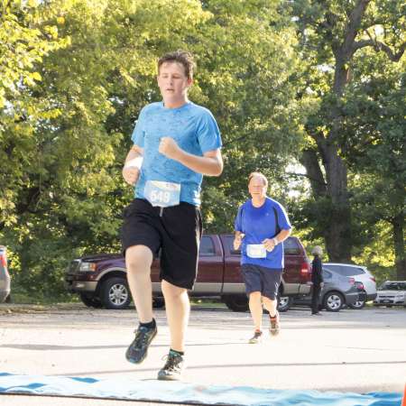 Runners cross the finish line.