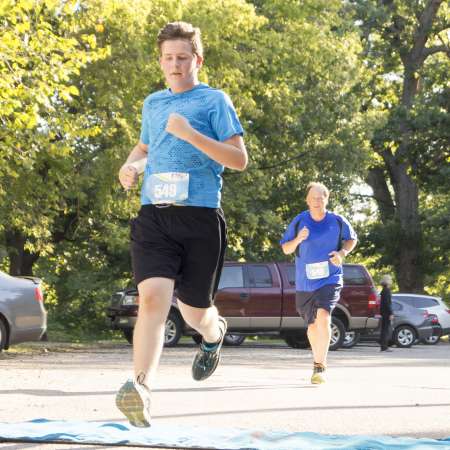 Runners cross the finish line.