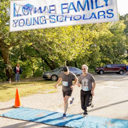 Runners cross the finish line.