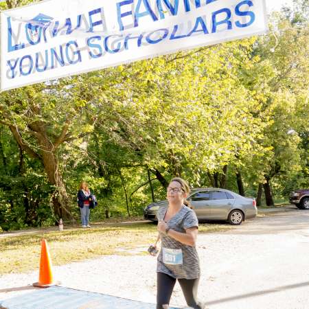 Runners cross the finish line.