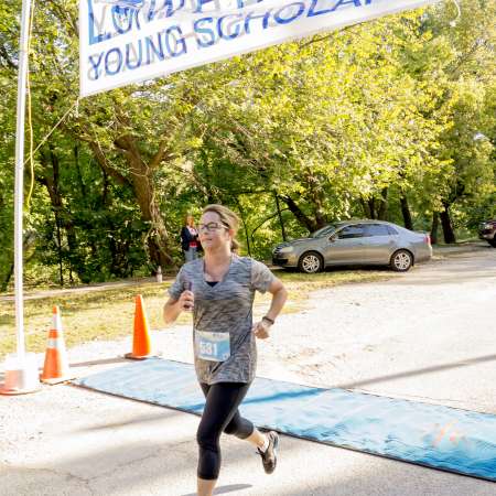 Runners cross the finish line.