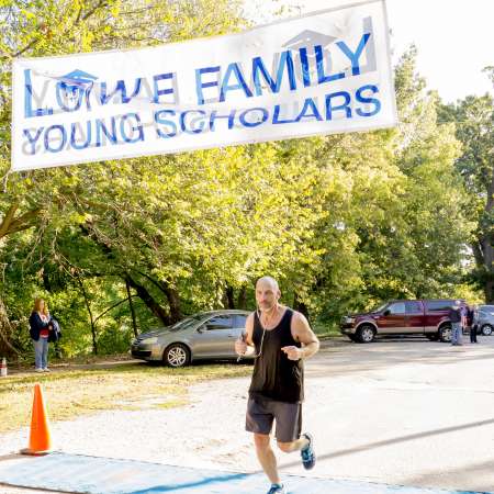 Runners cross the finish line.