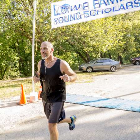 Runners cross the finish line.