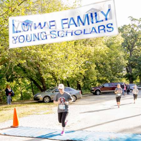 Runners cross the finish line.