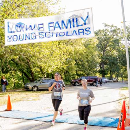 Runners cross the finish line.