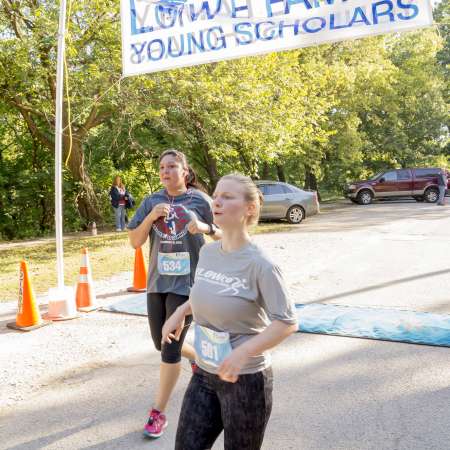 Runners cross the finish line.