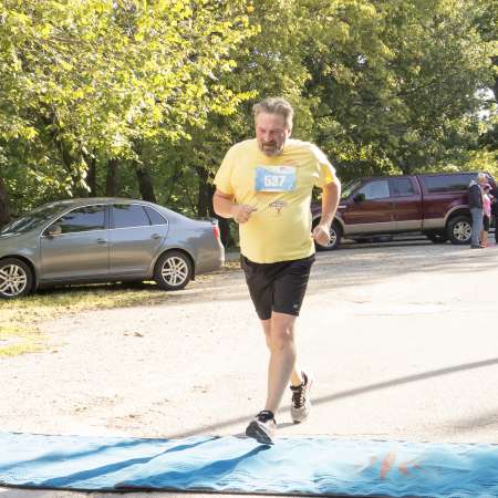 Runners cross the finish line.