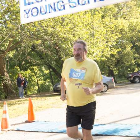 Runners cross the finish line.