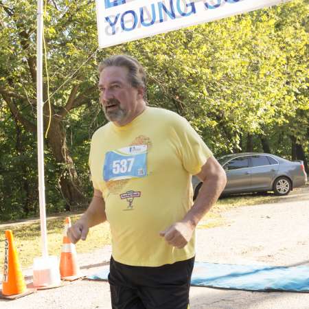 Runners cross the finish line.