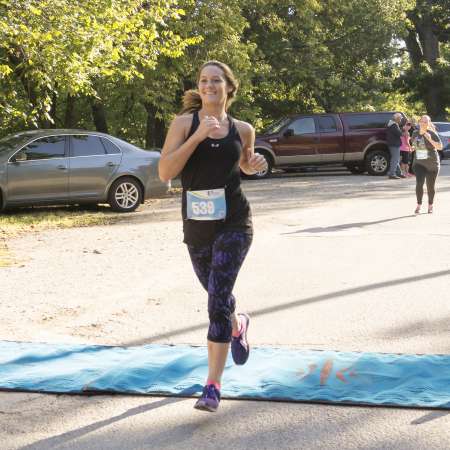 Runners cross the finish line.